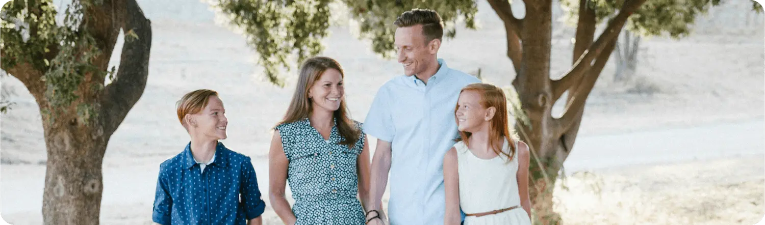 Woman standing in the middle of a grass field